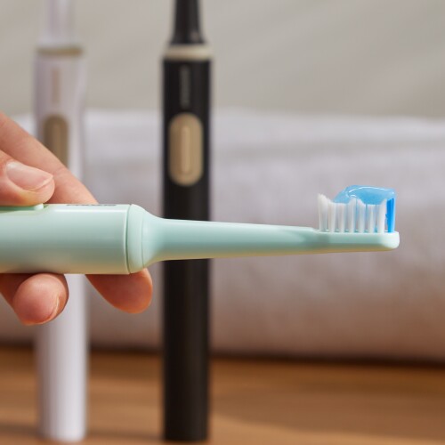 green electric toothbrush
